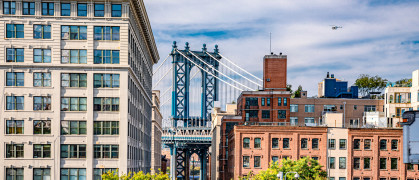 Dumbo is a vibrant Brooklyn neighborhood known for its artistic scene, offering spectacular views of the iconic Steel Manhattan Bridge.